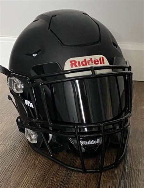 football helmet with black visor